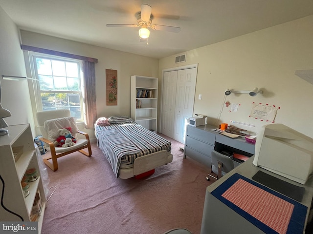 bedroom featuring carpet flooring, ceiling fan, and a closet