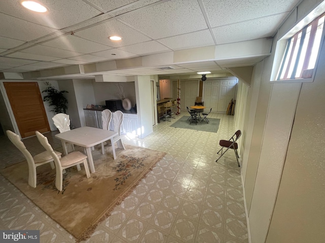 dining area with a paneled ceiling