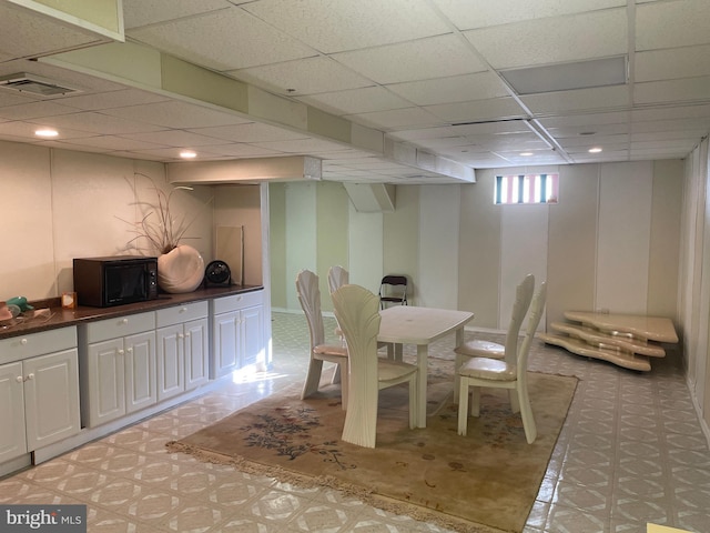 dining space featuring a paneled ceiling