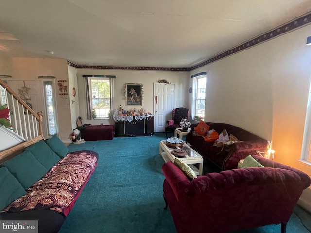 carpeted living room with a healthy amount of sunlight