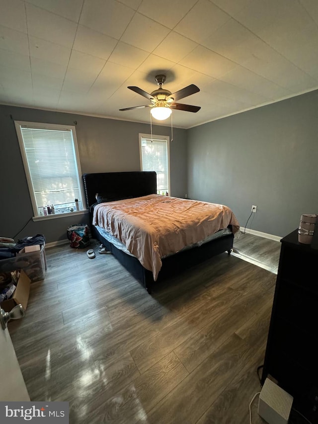 bedroom featuring dark wood-type flooring and ceiling fan