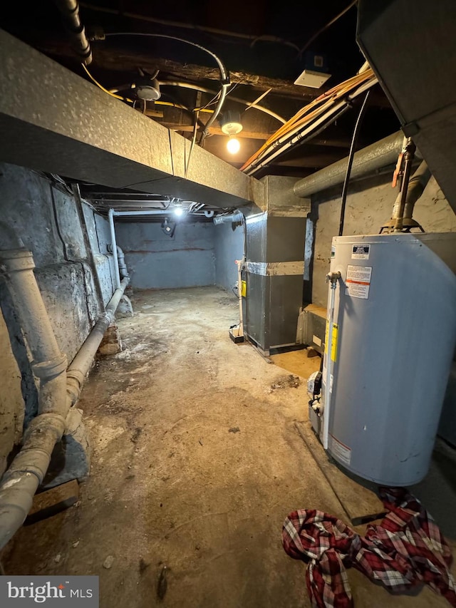 basement featuring heating unit and water heater