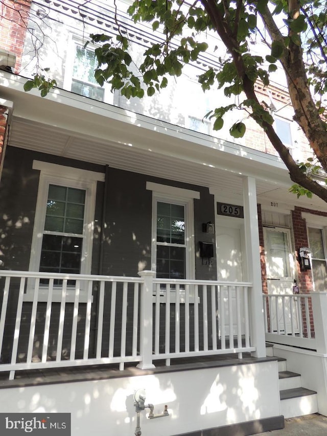 doorway to property with a porch