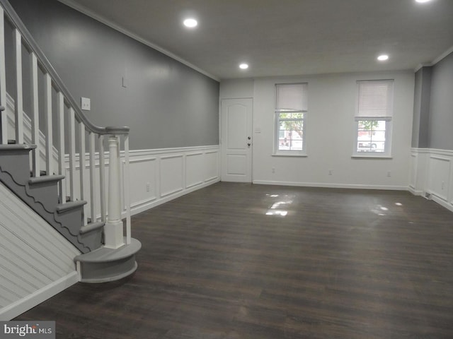 foyer featuring crown molding and dark hardwood / wood-style floors