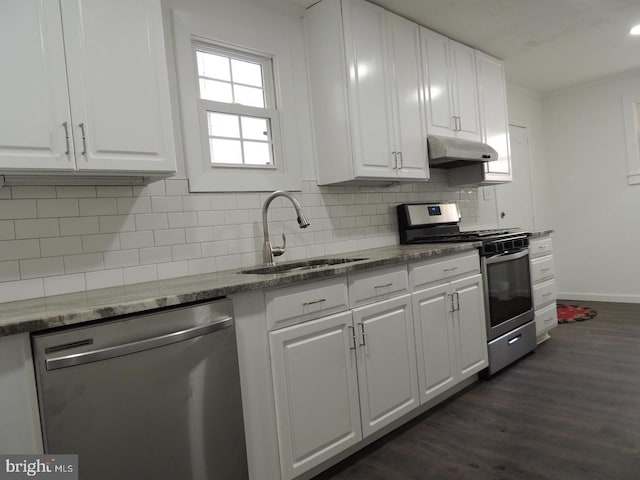 kitchen with white cabinetry, stainless steel appliances, and dark wood-type flooring