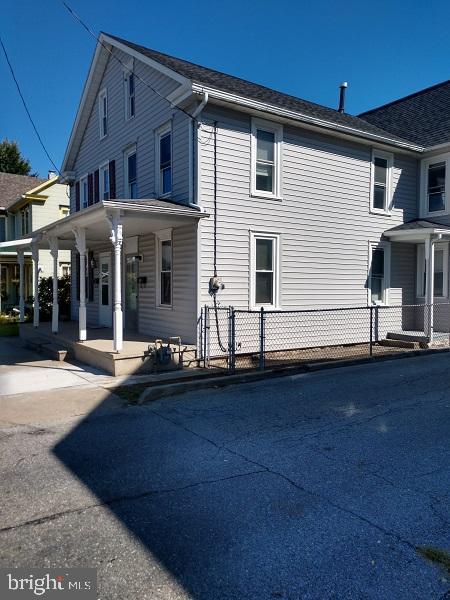 view of property exterior featuring a porch