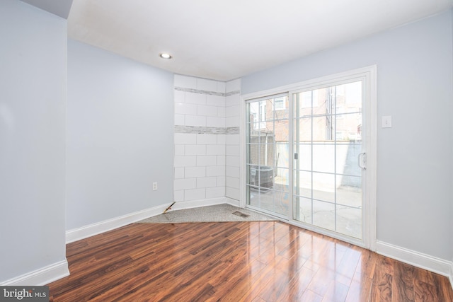 empty room featuring dark wood-type flooring