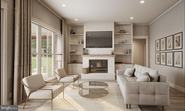 living room featuring wood-type flooring, a fireplace, ornamental molding, and a healthy amount of sunlight