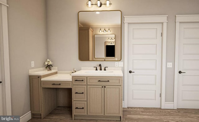 bathroom featuring wood-type flooring, vanity, and crown molding