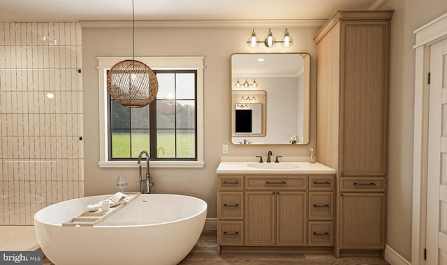 bathroom with a bathtub, crown molding, hardwood / wood-style floors, and vanity