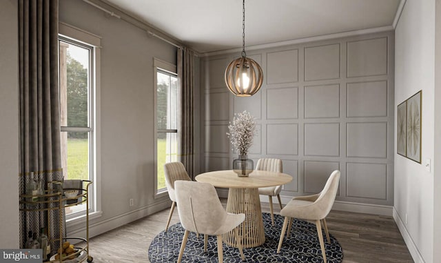 dining area featuring wood-type flooring and ornamental molding