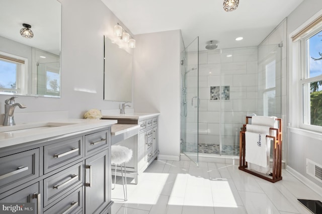 bathroom with vanity, tile patterned floors, and walk in shower