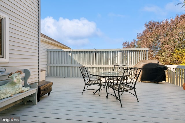 wooden terrace with area for grilling