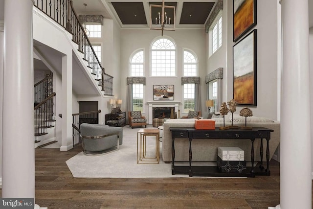 living room with beamed ceiling, a towering ceiling, dark wood-type flooring, and coffered ceiling