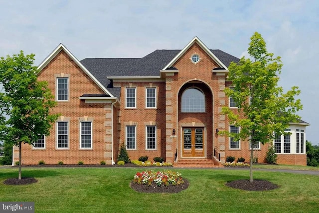 view of front of house featuring french doors and a front lawn