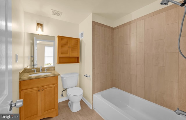 full bathroom featuring vanity, tile patterned floors, toilet, and tiled shower / bath