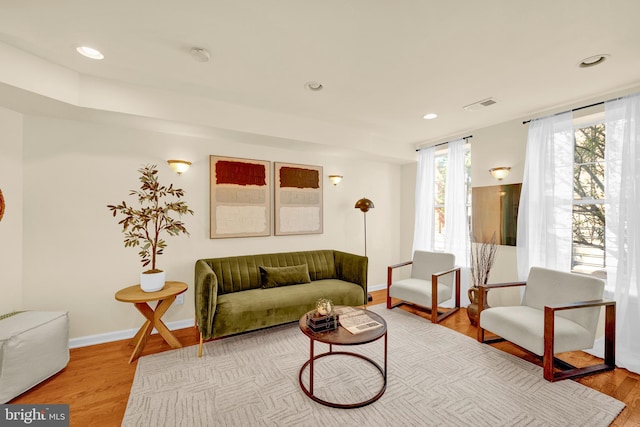 living room with light hardwood / wood-style flooring