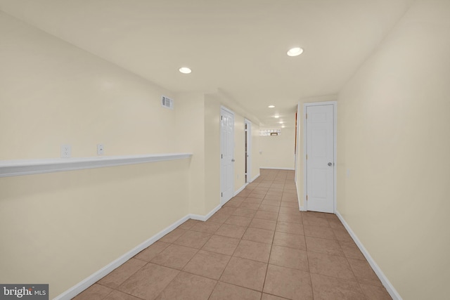 hallway featuring light tile patterned floors