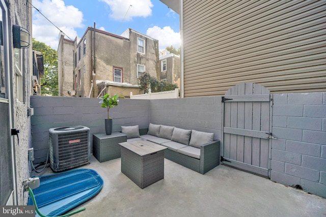 view of patio featuring central air condition unit and outdoor lounge area