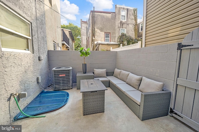 view of patio with outdoor lounge area and cooling unit