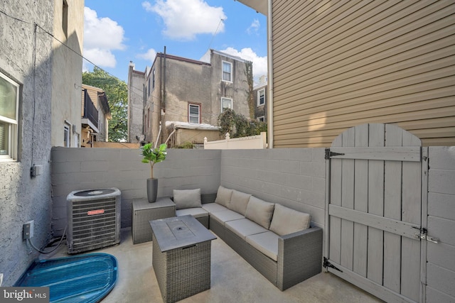 view of patio / terrace with central air condition unit and an outdoor living space