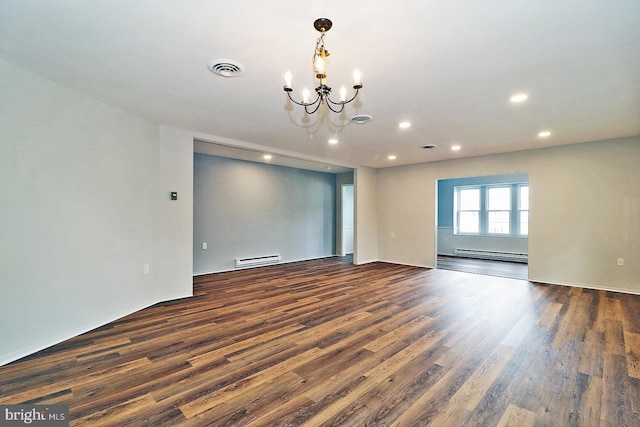 unfurnished room with a notable chandelier, a baseboard radiator, and dark hardwood / wood-style floors