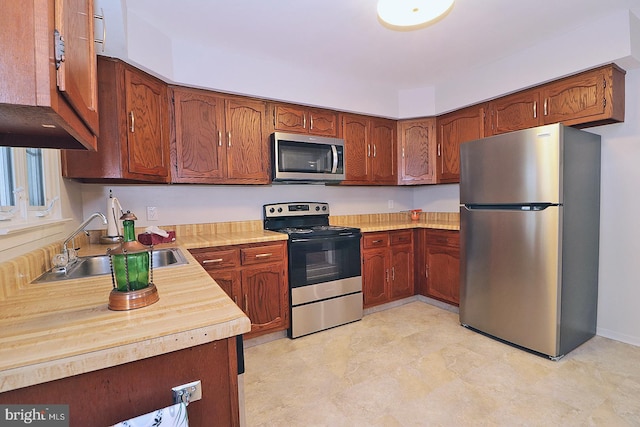 kitchen with appliances with stainless steel finishes and sink