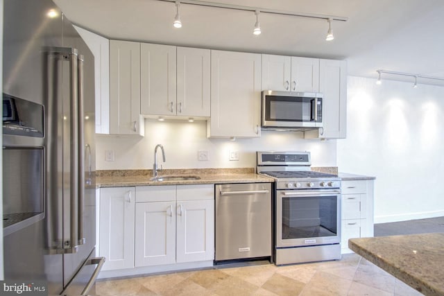 kitchen featuring sink, white cabinetry, and stainless steel appliances