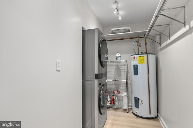 utilities with stacked washer / dryer and electric water heater