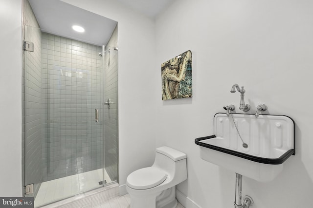 bathroom with toilet, an enclosed shower, and tile patterned floors