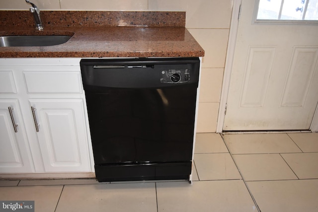 room details with sink, tile patterned floors, white cabinetry, and dishwasher