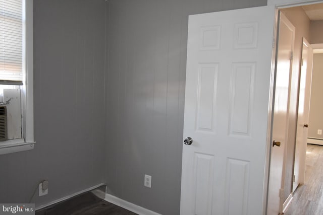 spare room with hardwood / wood-style floors