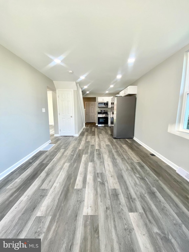 unfurnished living room featuring light hardwood / wood-style floors