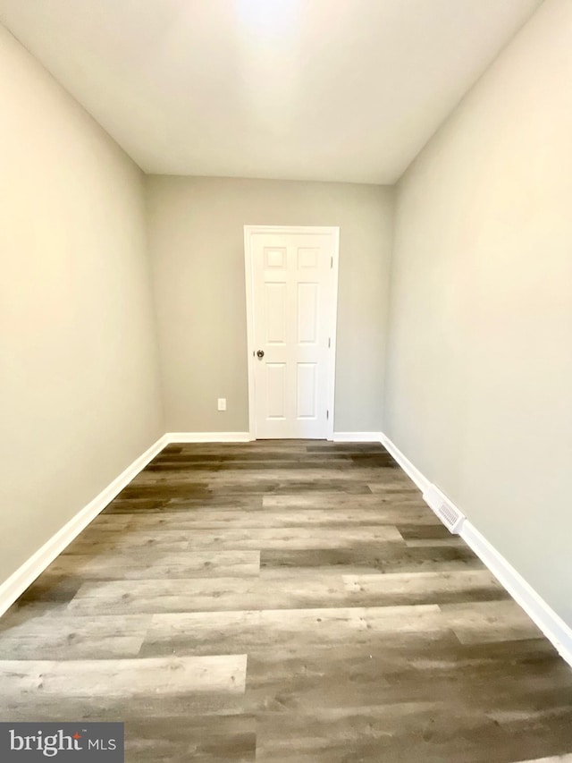 spare room featuring hardwood / wood-style flooring