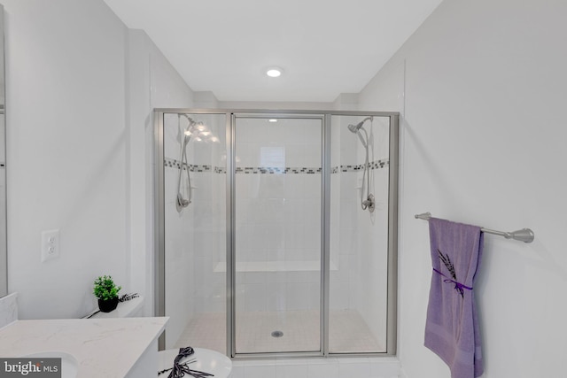 bathroom with vanity and an enclosed shower