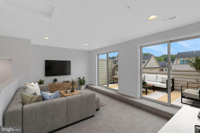 carpeted living room featuring a healthy amount of sunlight