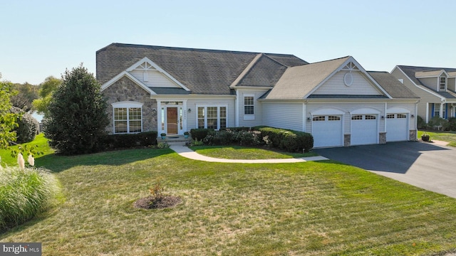 view of front of house featuring a front yard and a garage