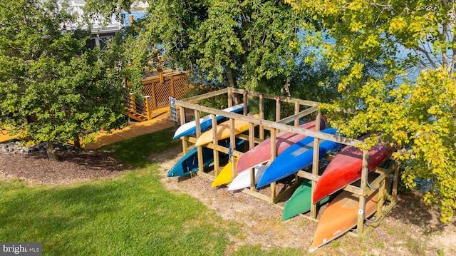 view of jungle gym featuring a yard and a deck