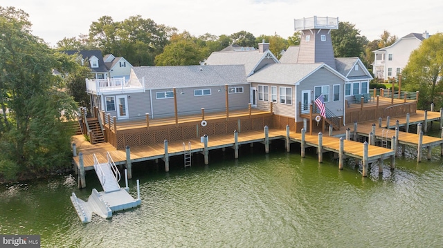 exterior space featuring a deck with water view