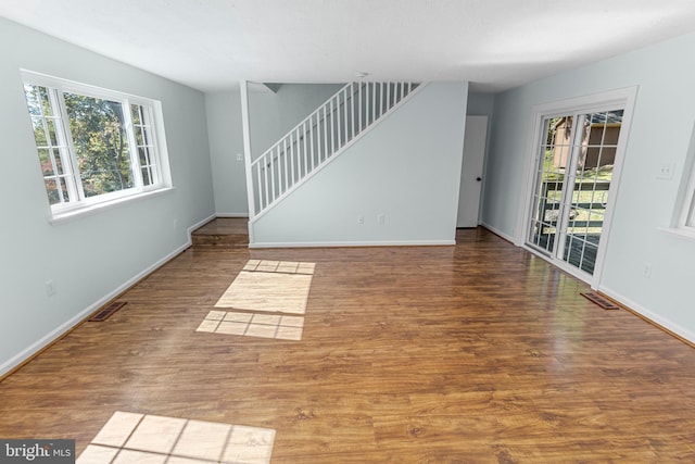 spare room with hardwood / wood-style floors