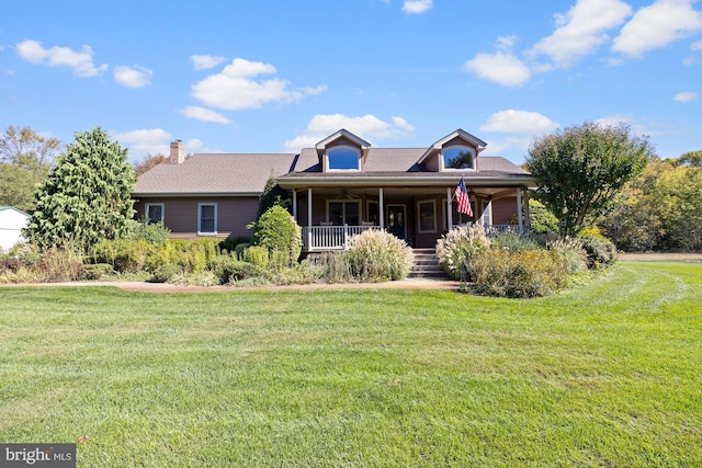 view of front of home featuring covered porch and a front lawn