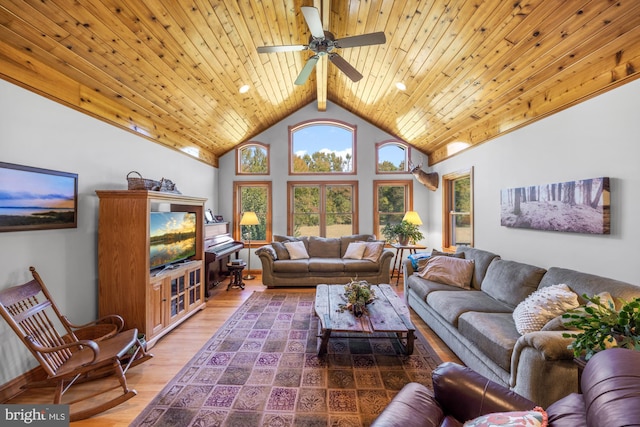 living room with wood ceiling, hardwood / wood-style floors, ceiling fan, beam ceiling, and high vaulted ceiling