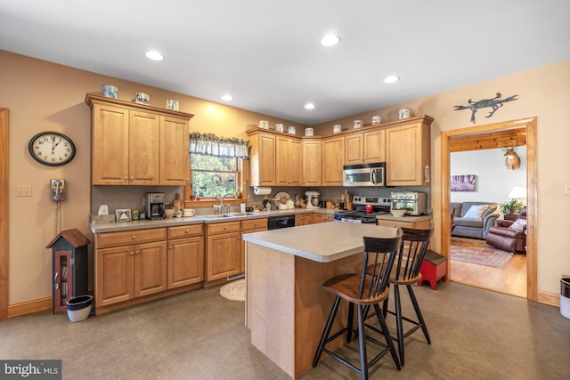 7000 Sockwell Rd, Port Norris, NJ 08349 - kitchen featuring a center island, a sink, a breakfast bar, light countertops, and appliances with stainless steel finishes