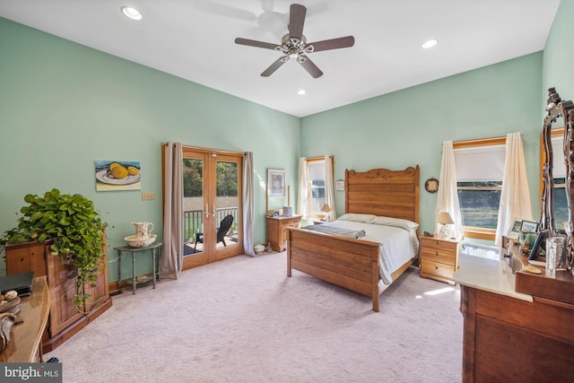 bedroom featuring light carpet, french doors, access to exterior, and ceiling fan