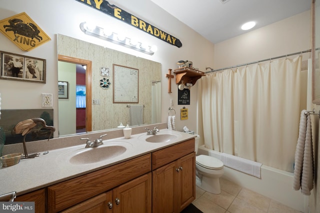 full bathroom featuring vanity, shower / tub combo with curtain, toilet, and tile patterned floors