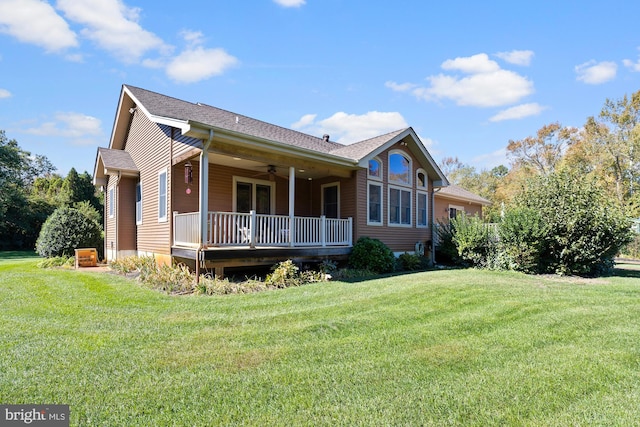 exterior space with a yard and ceiling fan