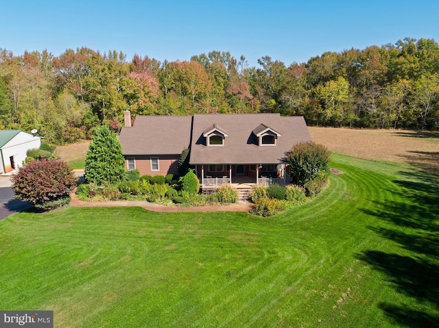 7000 Sockwell Rd, Port Norris, NJ 08349 - view of front of home with a front yard, a wooded view, and covered porch
