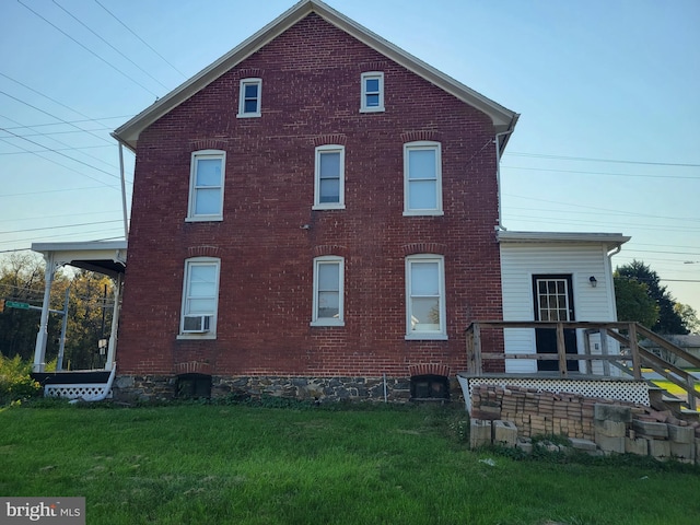 rear view of house with a lawn