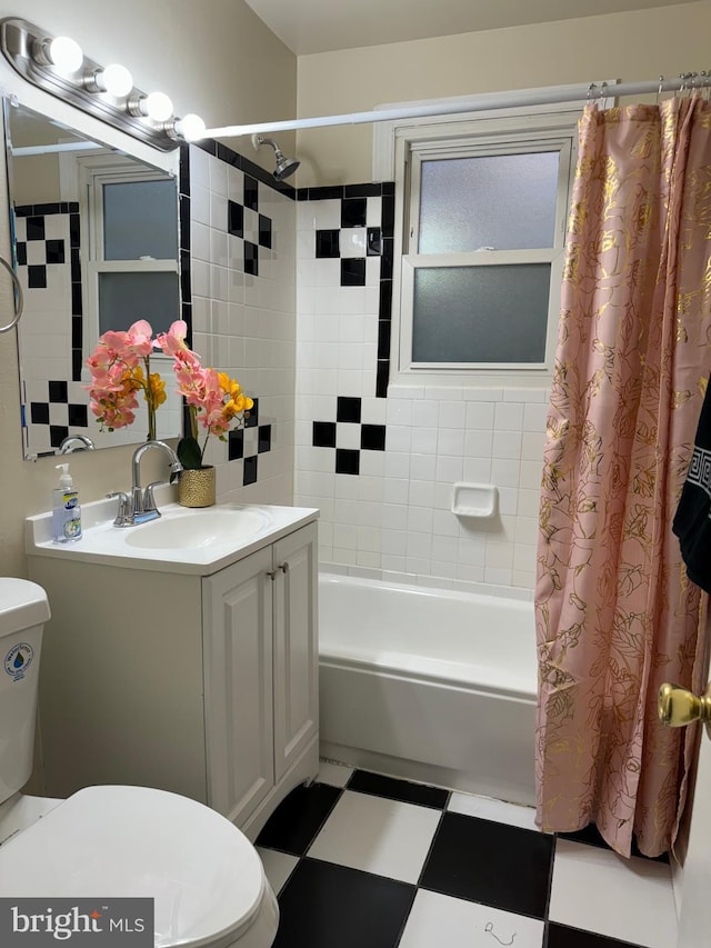 full bathroom featuring vanity, toilet, and shower / bath combo