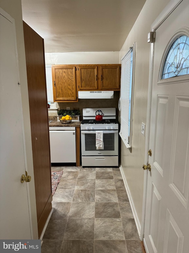 kitchen featuring range hood and stainless steel gas stove